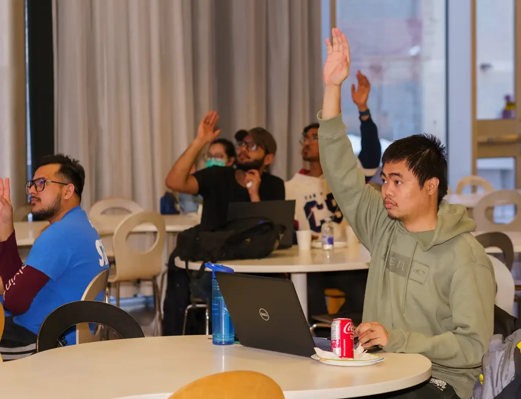 one student raising their hand.